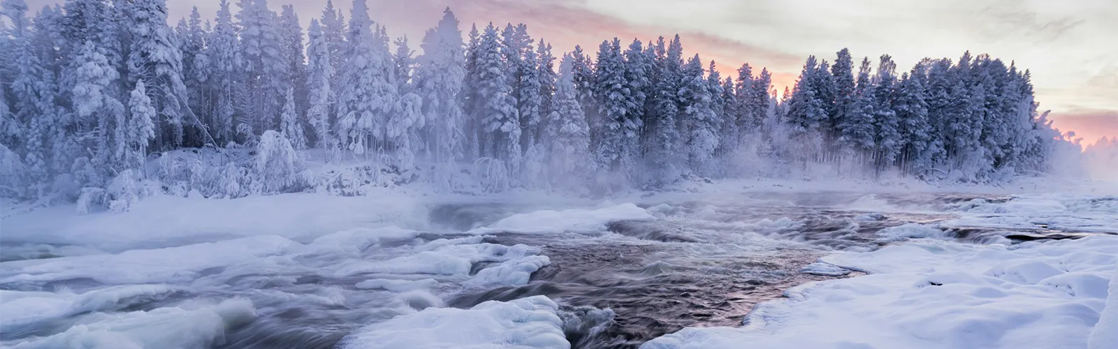 A view of a flowing river in a winter landscape